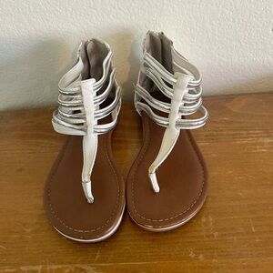 Youth size, one justice, gladiator, white, and silver sandals